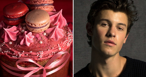 A beautiful landscape photo with mountains, clear sky and a serene lake, surrounded by lush greenery.